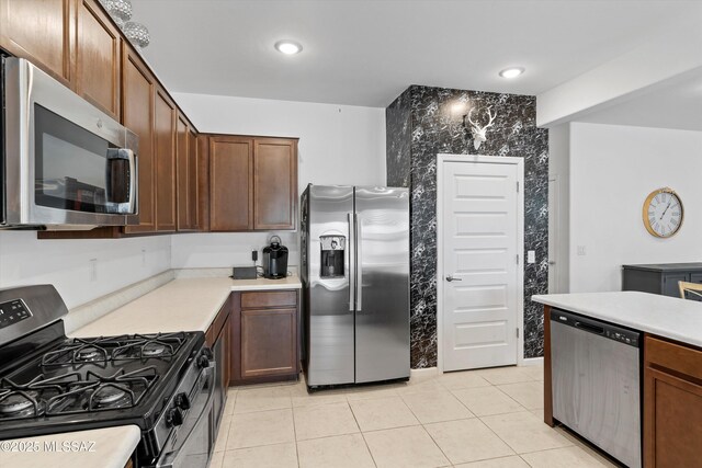 22082 E Thunderhead Dr, Red Rock, AZ 85145 - kitchen featuring light countertops, stainless steel appliances, and light tile patterned flooring