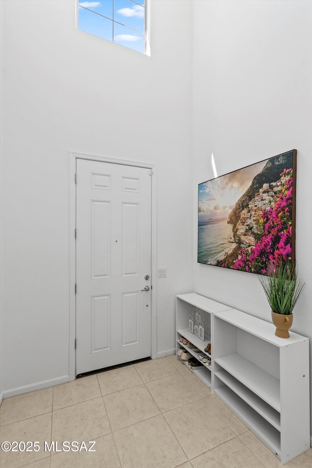 22082 E Thunderhead Dr, Red Rock, AZ 85145 - tiled foyer featuring baseboards and a towering ceiling
