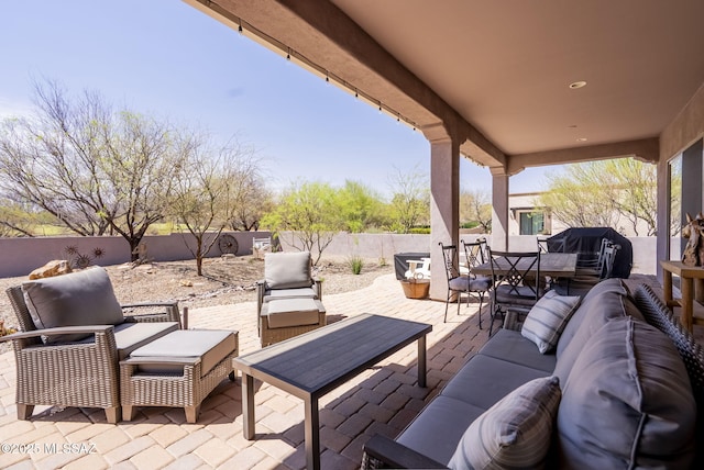 view of patio with outdoor lounge area, grilling area, outdoor dining area, and a fenced backyard