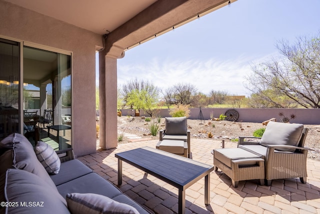 view of patio featuring outdoor lounge area and a fenced backyard