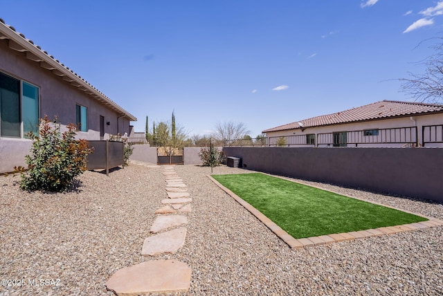 view of yard featuring a fenced backyard