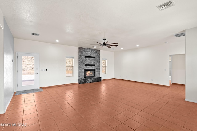 unfurnished living room with light tile patterned flooring, ceiling fan, and visible vents