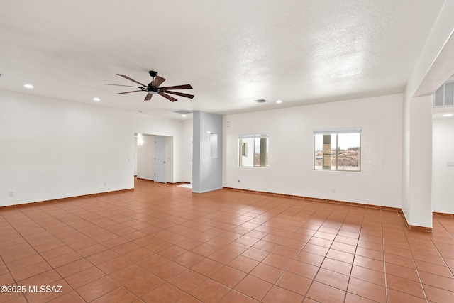 unfurnished room featuring a textured ceiling, a ceiling fan, recessed lighting, and light tile patterned floors