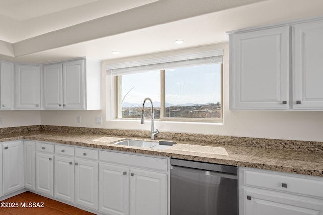 kitchen featuring white cabinetry, tile patterned flooring, recessed lighting, a sink, and dishwasher