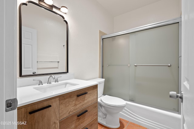 bathroom featuring tile patterned floors, toilet, and vanity