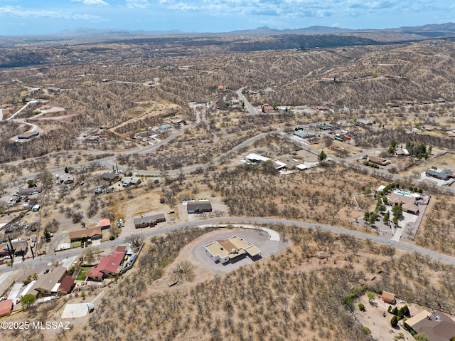 bird's eye view featuring a desert view and a mountain view