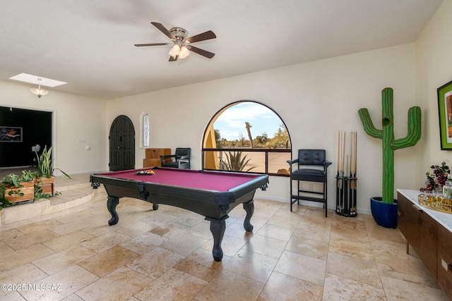 playroom with baseboards, billiards, a ceiling fan, and stone tile floors