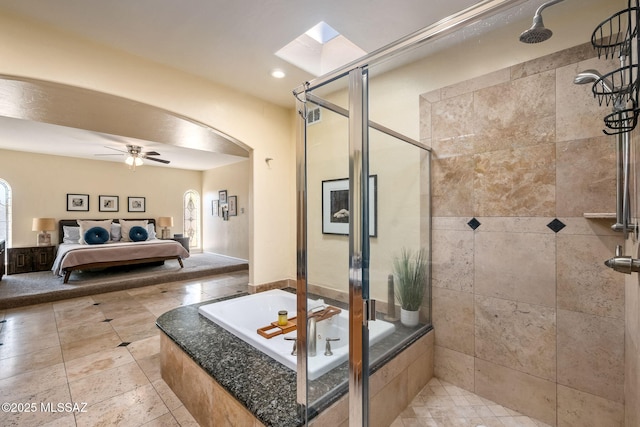 ensuite bathroom with ceiling fan, tiled bath, a tile shower, and connected bathroom