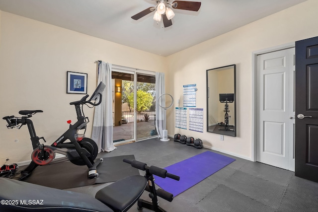 exercise room with baseboards and ceiling fan