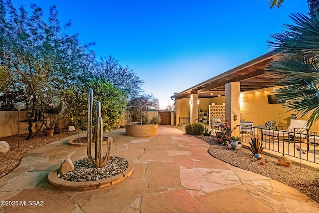 view of patio / terrace featuring fence