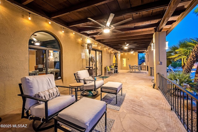 view of patio featuring a ceiling fan