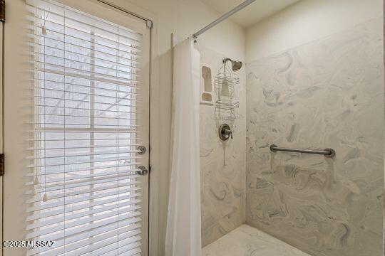 bathroom featuring curtained shower