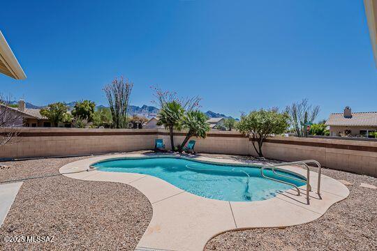 view of swimming pool featuring a fenced backyard, a patio, and a fenced in pool