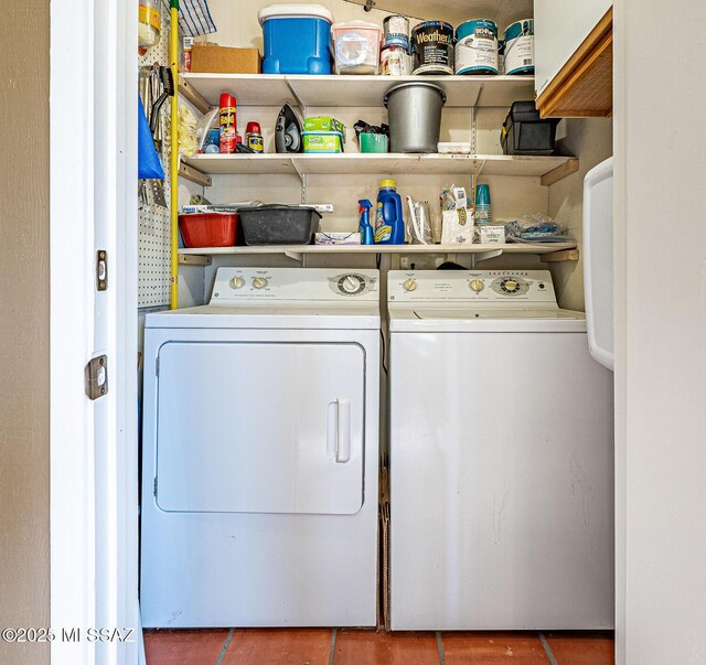 washroom featuring washing machine and dryer and laundry area