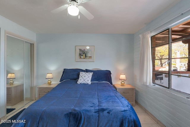 bedroom featuring tile patterned floors and a ceiling fan