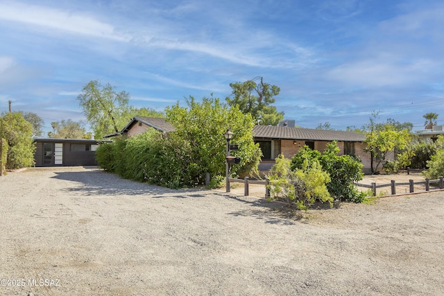 3256 E Terra Alta Blvd, Tucson, AZ 85716 - view of property hidden behind natural elements with fence and dirt driveway