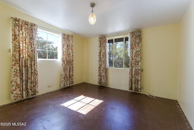 3256 E Terra Alta Blvd, Tucson, AZ 85716 - empty room with healthy amount of natural light and concrete flooring