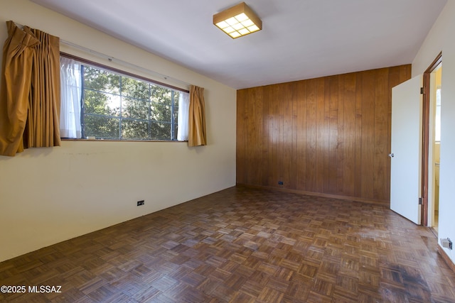 3256 E Terra Alta Blvd, Tucson, AZ 85716 - spare room featuring wooden walls and an accent wall