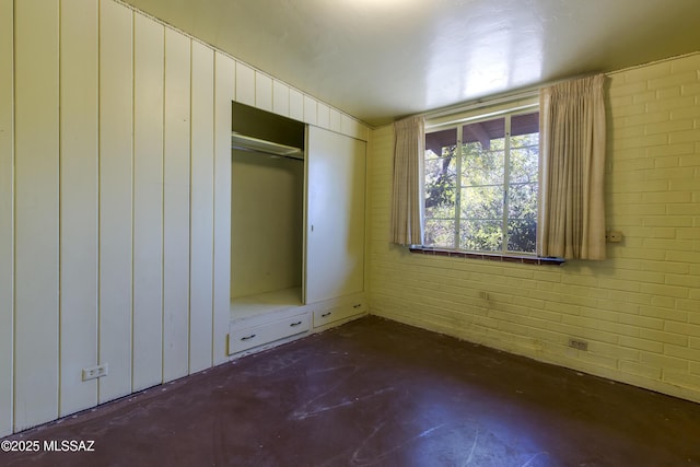3256 E Terra Alta Blvd, Tucson, AZ 85716 - unfurnished bedroom featuring unfinished concrete flooring and a closet