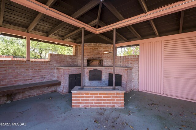 3256 E Terra Alta Blvd, Tucson, AZ 85716 - view of patio / terrace featuring an outdoor brick fireplace and fence