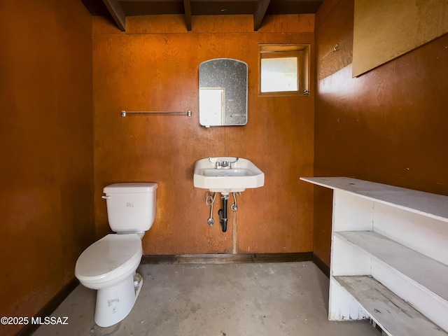 3256 E Terra Alta Blvd, Tucson, AZ 85716 - bathroom with toilet, unfinished concrete floors, beam ceiling, and a sink