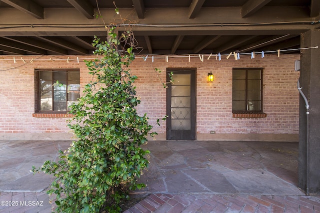 3256 E Terra Alta Blvd, Tucson, AZ 85716 - entrance to property featuring brick siding and a patio