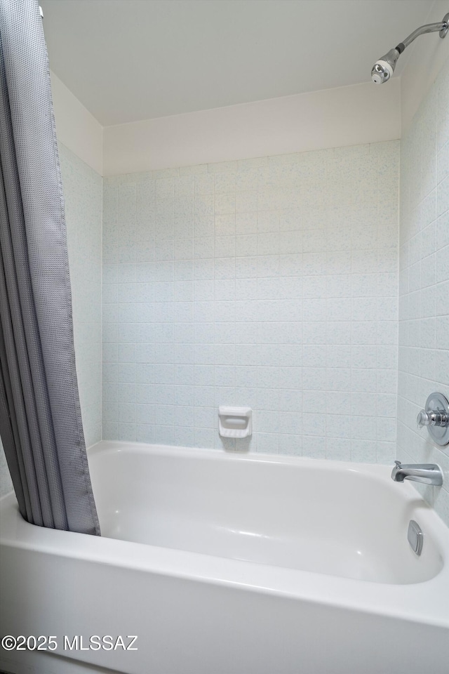 bathroom featuring shower / bath combination with curtain