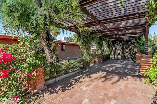 view of patio featuring a pergola