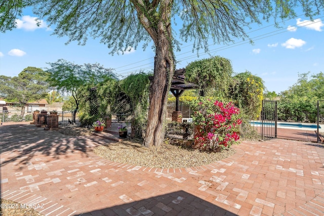 view of patio / terrace featuring fence and a fenced in pool