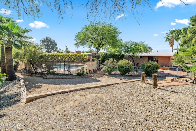 exterior space with fence and a fenced in pool