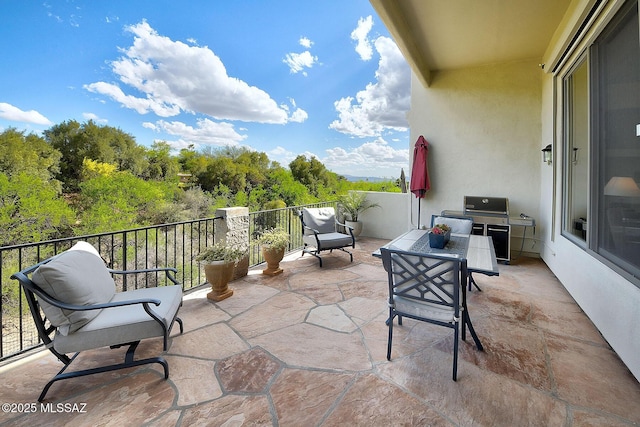 view of patio with a balcony