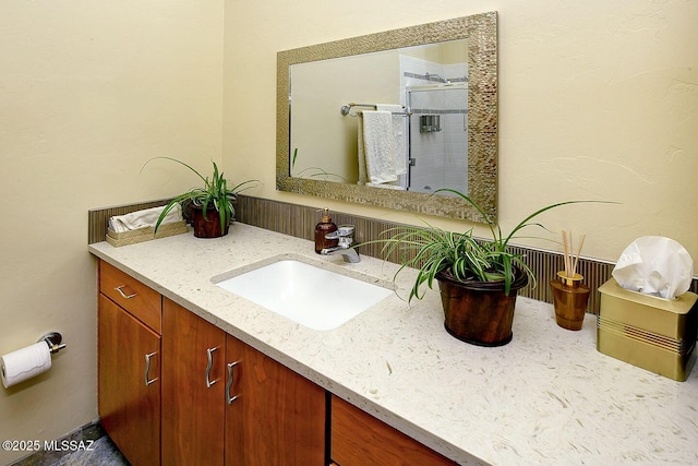 bathroom with vanity and a stall shower