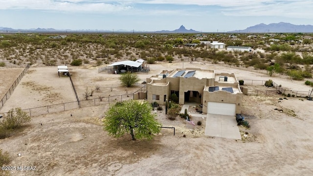 bird's eye view featuring a rural view, a mountain view, and a desert view