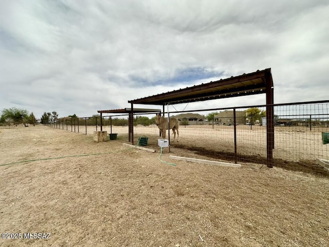 view of home's community with fence