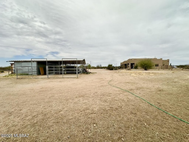 view of yard featuring an exterior structure and an outdoor structure