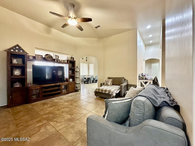 living area with visible vents, arched walkways, a ceiling fan, recessed lighting, and light tile patterned flooring