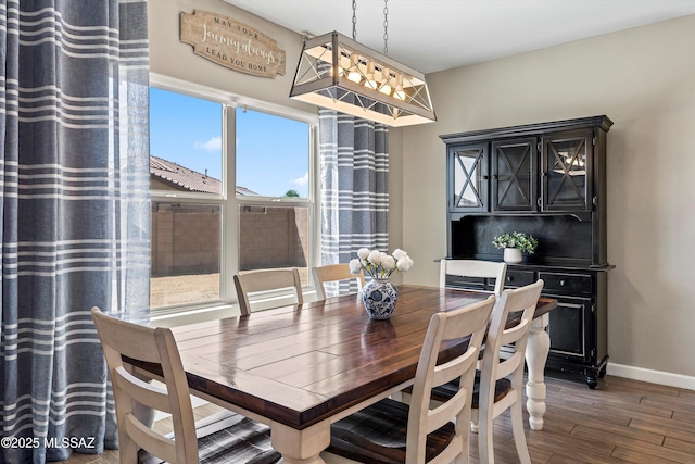 dining room with wood finished floors and baseboards