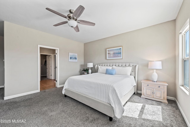 bedroom with ceiling fan, baseboards, carpet flooring, and multiple windows