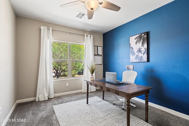 home office with baseboards, a ceiling fan, visible vents, and carpet