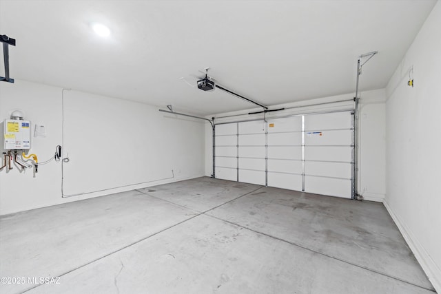garage with tankless water heater and a garage door opener