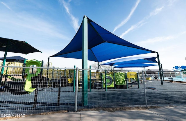 community jungle gym featuring fence