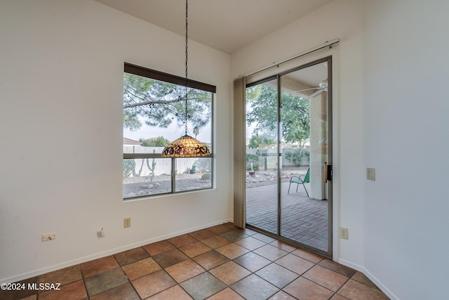 unfurnished dining area featuring baseboards