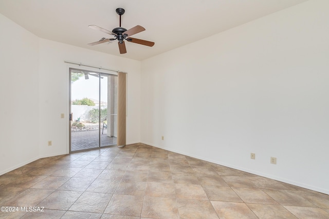 unfurnished room featuring baseboards and a ceiling fan