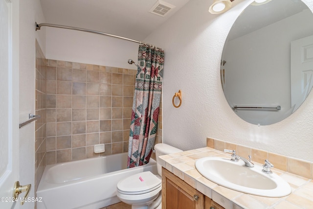 bathroom featuring vanity, visible vents, toilet, shower / bath combo, and a textured wall