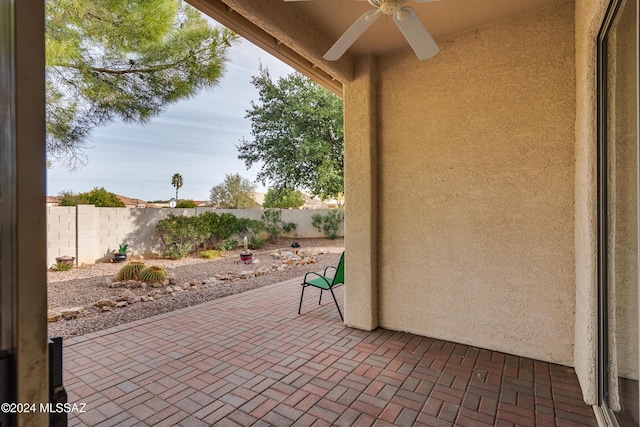 view of patio / terrace with a fenced backyard and ceiling fan