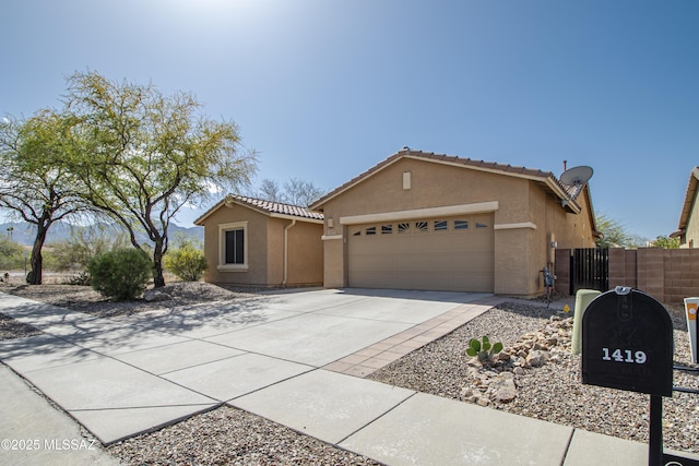 1419 W Red Creek Dr, Tucson, AZ 85737 - ranch-style home with driveway, an attached garage, stucco siding, and a tiled roof