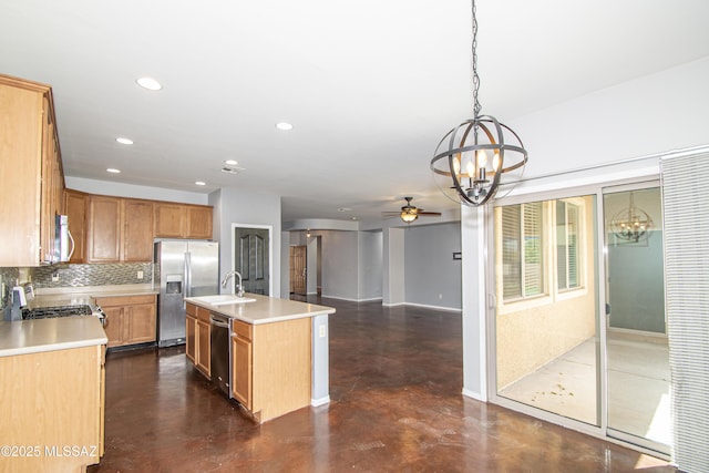 1419 W Red Creek Dr, Tucson, AZ 85737 - kitchen featuring a chandelier, appliances with stainless steel finishes, finished concrete flooring, tasteful backsplash, and light countertops