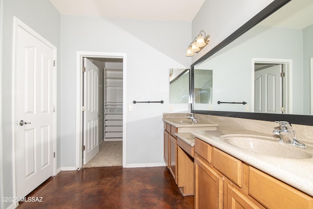 1419 W Red Creek Dr, Tucson, AZ 85737 - full bathroom with double vanity, concrete floors, and a walk in closet