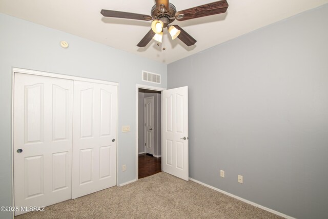 1419 W Red Creek Dr, Tucson, AZ 85737 - unfurnished bedroom featuring carpet, a closet, and a ceiling fan