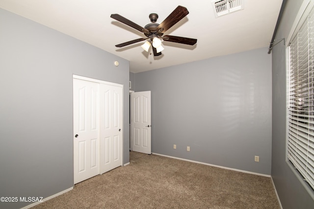 1419 W Red Creek Dr, Tucson, AZ 85737 - unfurnished bedroom featuring carpet floors, a closet, and a ceiling fan